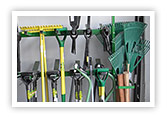 Assortment of Lasher gardening tools like rakes,  spades and gardening fork.