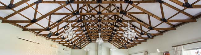 Exposed pine timber roof trusses at Eureka wedding venue